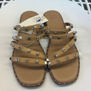 A. New Day. Size 7. New Tan studded sandals.